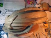 Adding a clay barrier around the base of the sculpture
