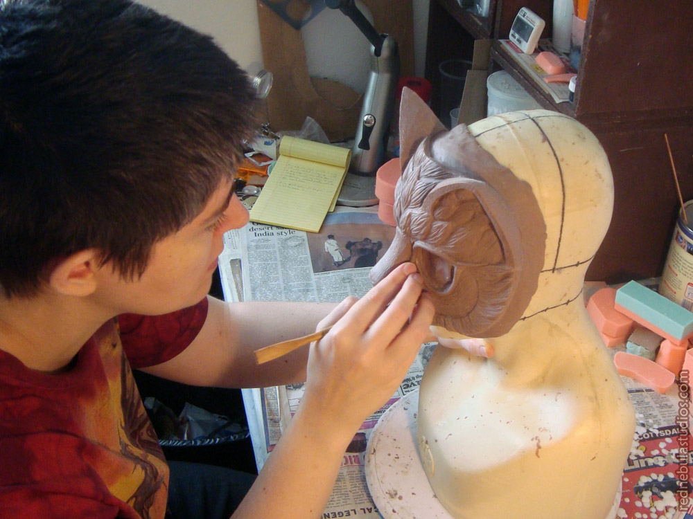 Sculpting the cat mask in clay