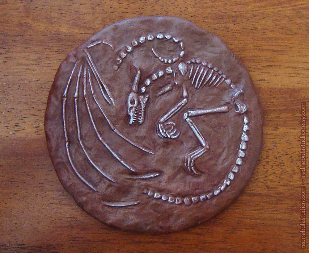 Painted round dragon fossil
