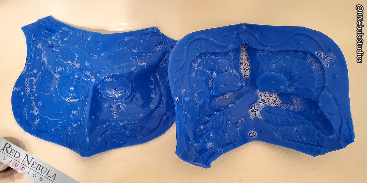 The two silicone halves of the mold getting a soapy bath to clean off residue from the molding process.