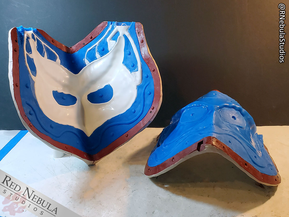 The owl mask matrix mold, opened up to show the result of a cast mask inside.