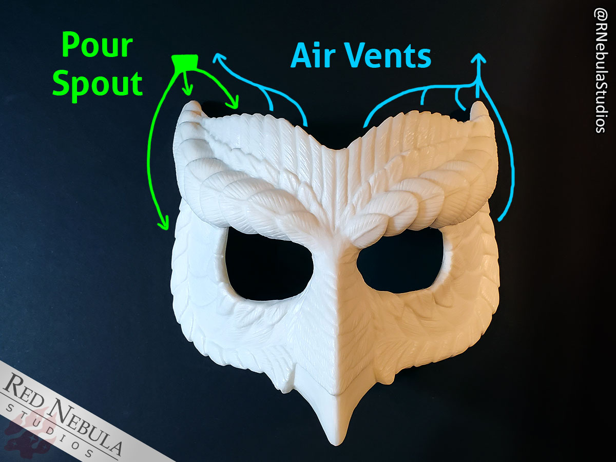 A blank white resin owl mask with labeled arrows showing where the pour spout and air vents in the mold will be.