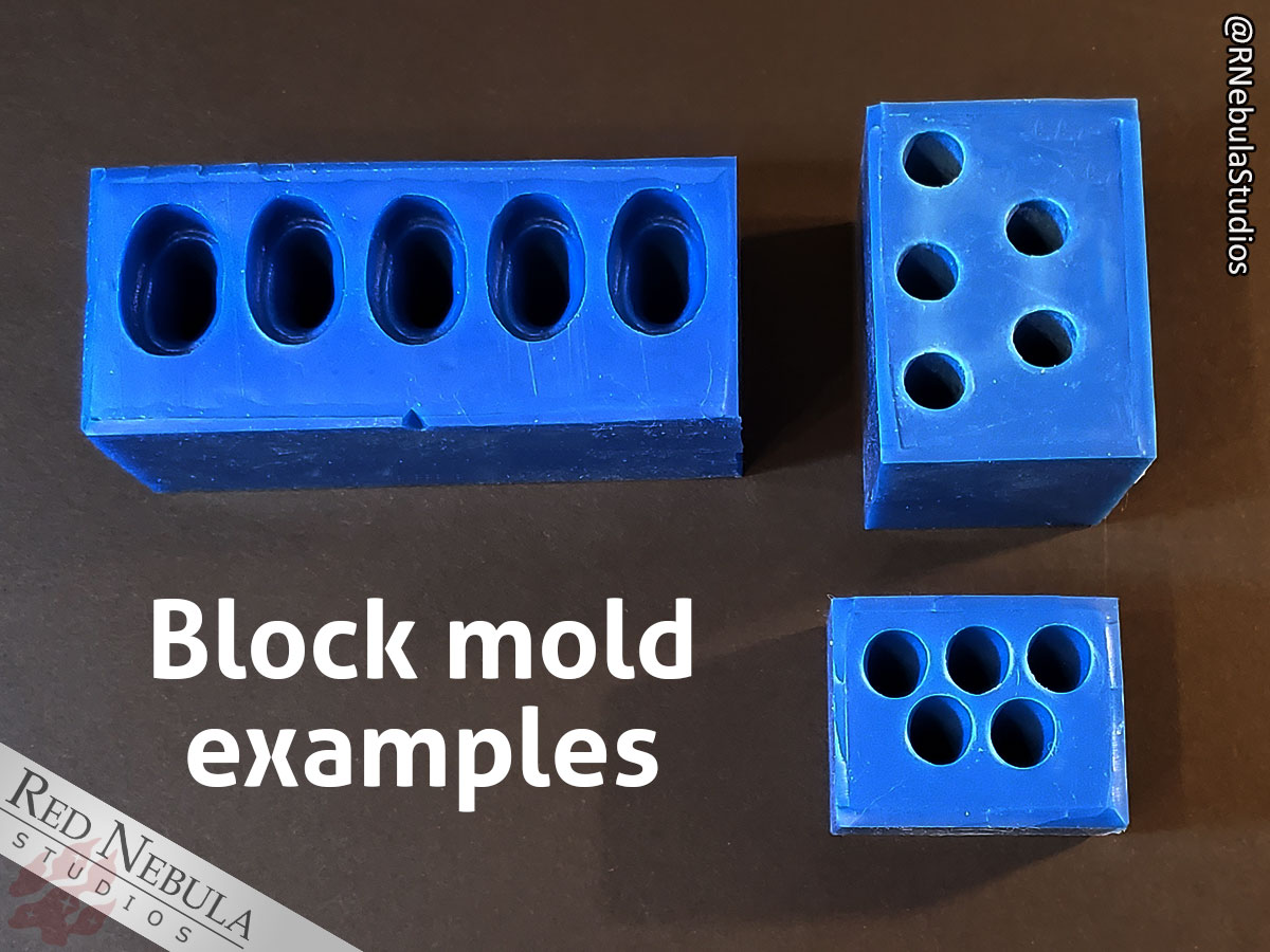 Three example blue silicone block molds for making fangs and claws.