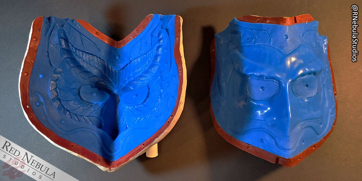 An example matrix mold in blue silicone of an owl mask.
