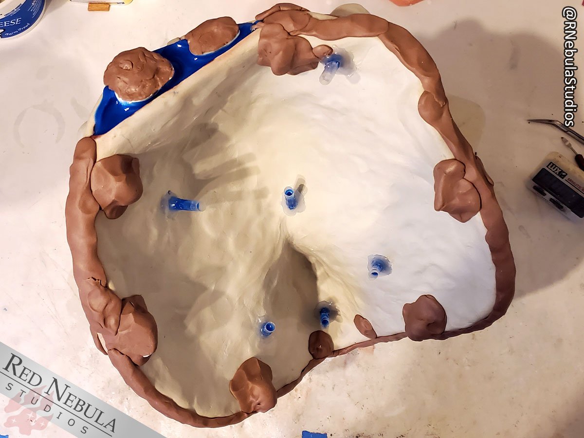 The closed wolf matrix mold in progress, filled with blue silicone.